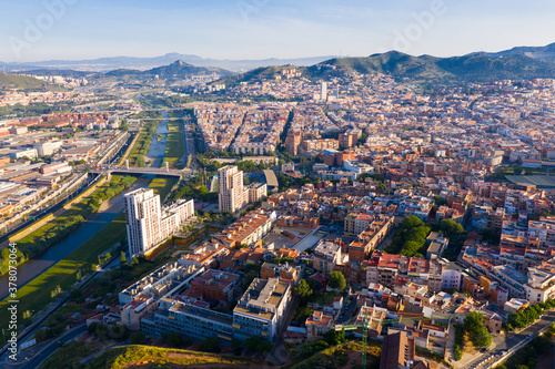 Aerial urban landscape of Santa Coloma de Gramenet municipality and Besos river, Catalonia, Spain