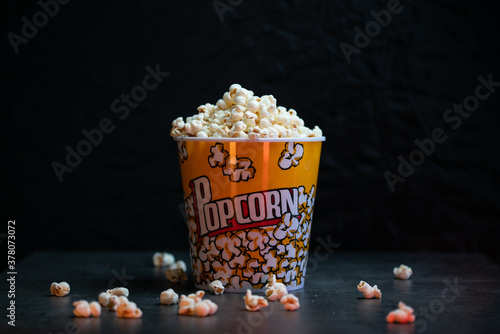 A bucket full of popcorn black background