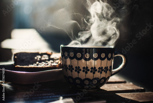 Selective focus shot of a cup of hot coffee