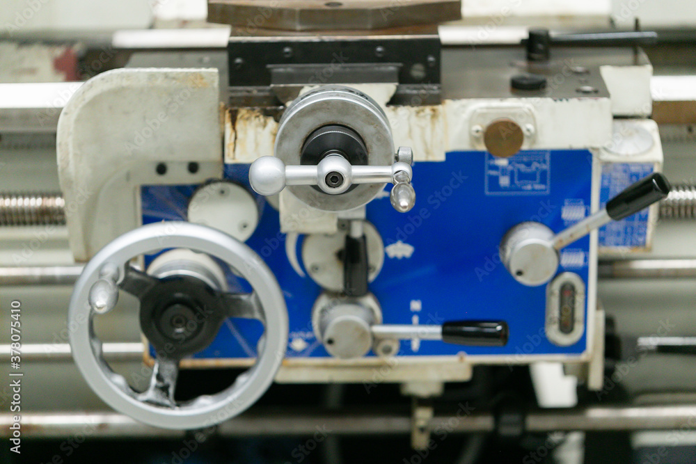 Obraz premium Machine part with pneumatic equipment and hydraulic system, electric part and a mechanical device for manufacturing in the industrial factory
