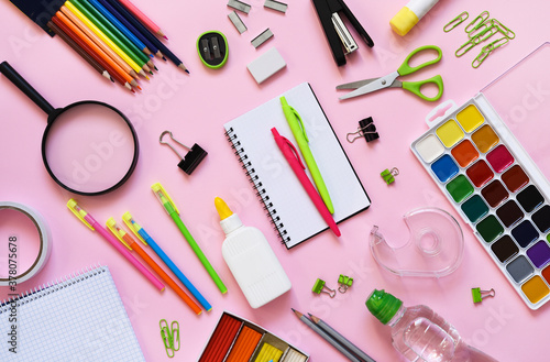 School supplies on a paper pink background. Back to school.