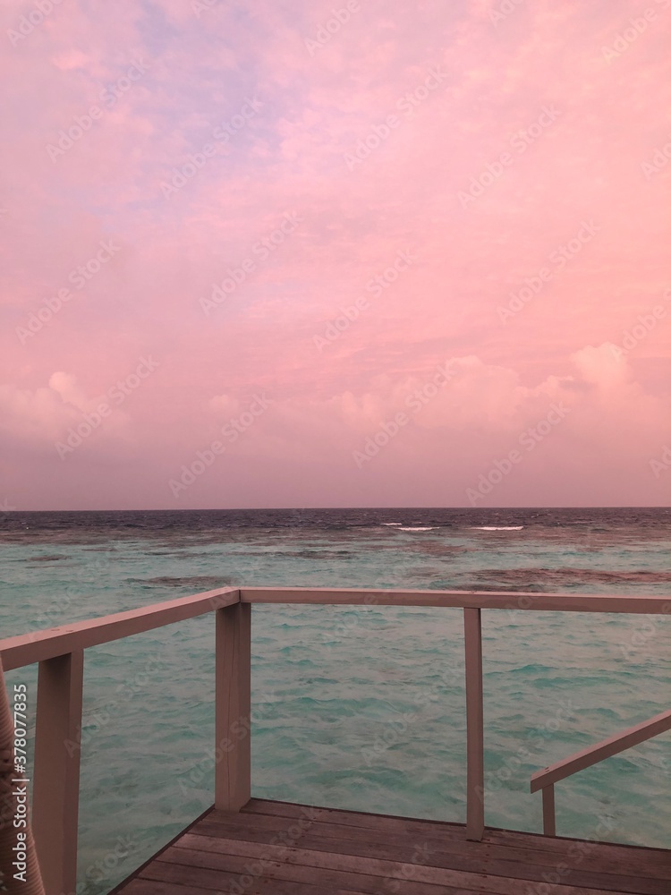 View of the pink sunrise on the pier
