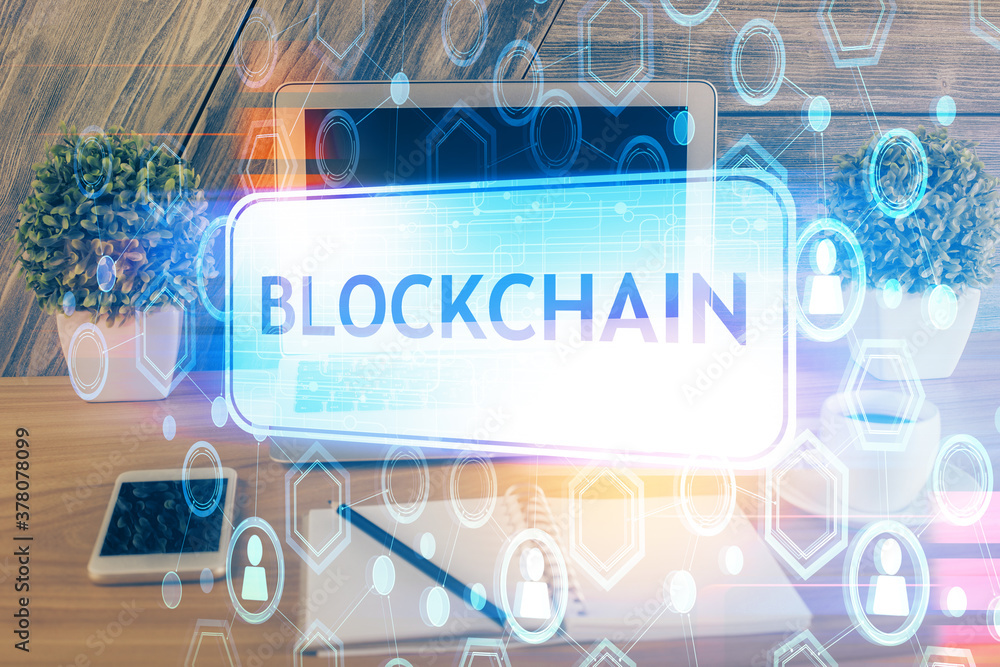 Multi exposure of blockchain theme hologram and table with computer background. Concept of bitcoin crypto currency. Multi exposure of blockchain theme hologram and table with computer background. Concept of bitcoin crypto currency.
