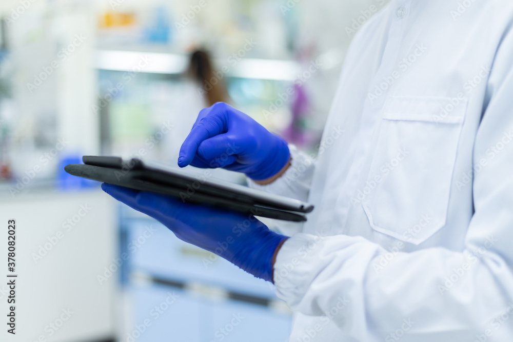 Picture of hand scientists using tablet a search data in lab , Concept science and technology, Science background Picture of hand scientists using tablet a search data in lab , Concept science and technology, Science background