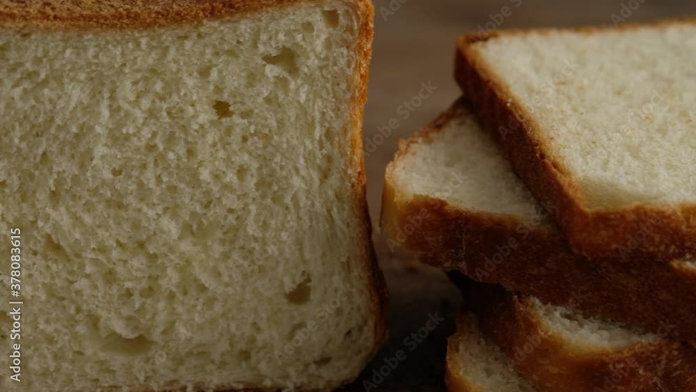 Homemade toast bread. Slices of toast bread. Homemade wheat bread. 4K. Homemade toast bread. Slices of toast bread. Homemade wheat bread. 4K.