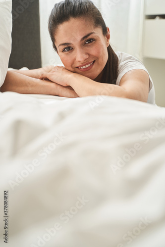Lovely female taking a rest in a bedroom
