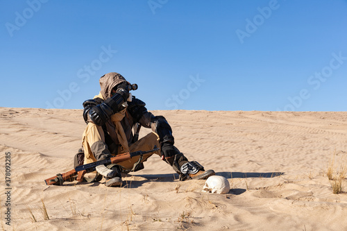 Billede på lærred Post apocalyptic warrior sitting in the desert.