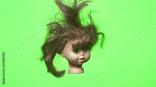 old dolls head rotating green screen 