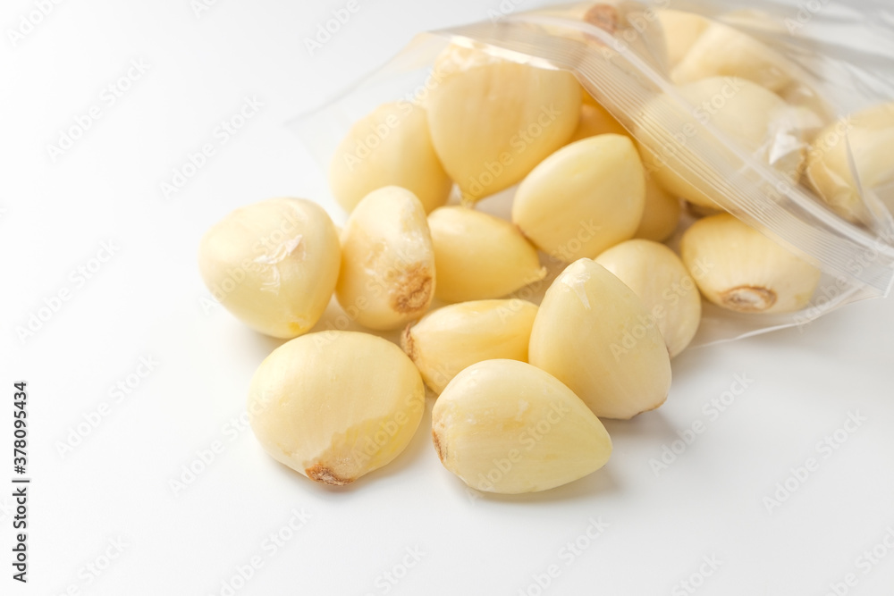 Manicured garlic on white background