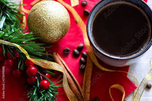 Christmas coffee hot drink in mug with cinnamon sticks flat lay morning drink in cup with new year decorations around