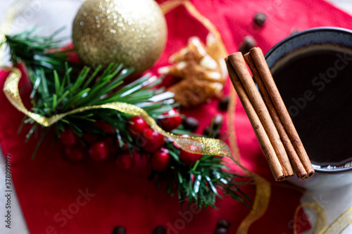 Christmas coffee hot drink in mug with cinnamon sticks flat lay morning drink in cup with new year decorations around