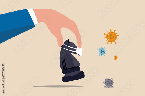 Business strategy in crisis, solution or idea to pass Coronavirus COVID-19 pandemic concept, investor or company owner hand holding chess knight wearing face mask to fight with Coronavirus pathogen.