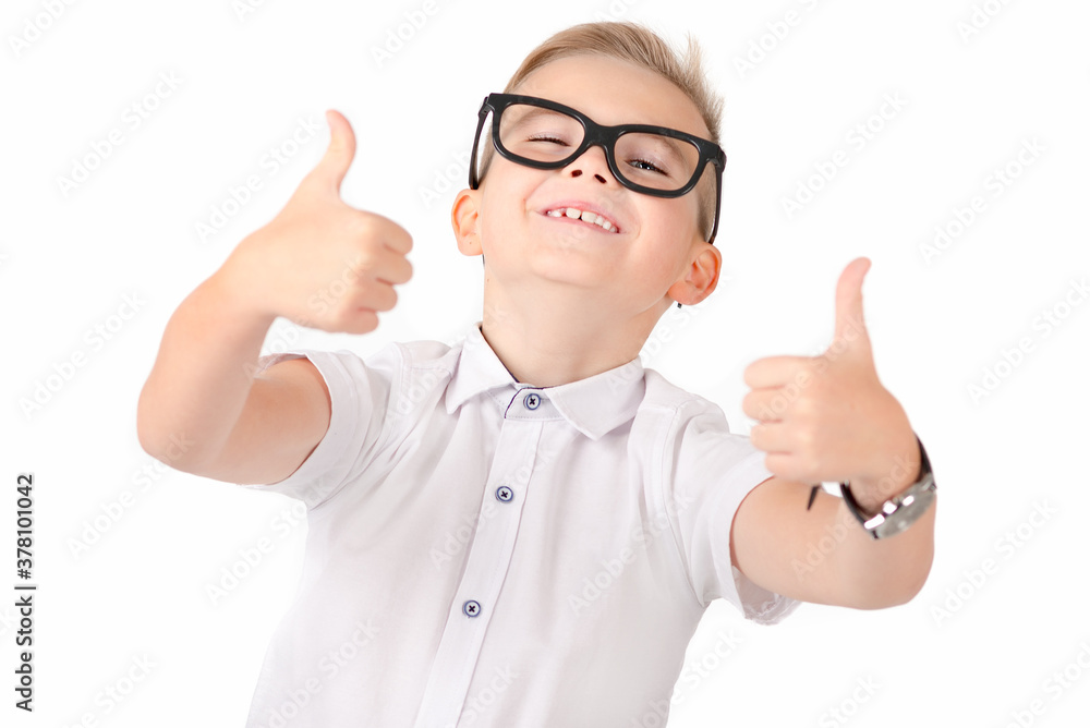 Close up Portrait of atractive elementary school student showing his thumbs up on isolated white background Close up Portrait of atractive elementary school student showing his thumbs up on isolated white background