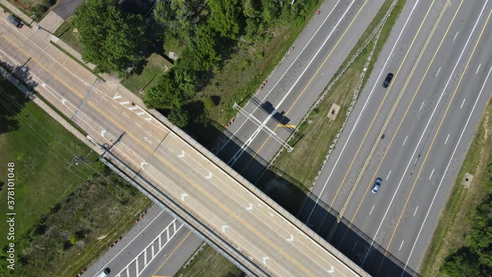 High above highways, interchanges the roads band and the interstate takes you on a fast transportation highway in Cleveland Ohio US drone view High above highways, interchanges the roads band and the interstate takes you on a fast transportation highway in Cleveland Ohio US drone view