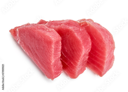 Three tuna steaks isolated on white background. Top view of slices of tuna meat.