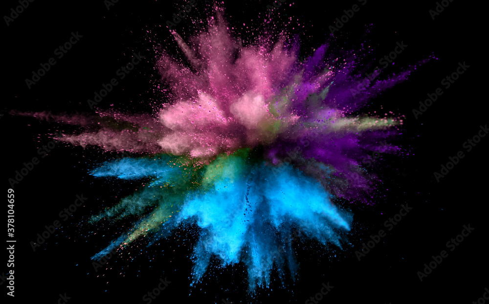 Fototapeta premium Colored powder explosion on black background. Freeze motion.