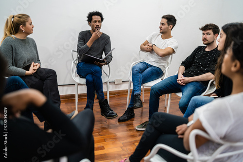 Multiethnic creative people having a brainstorming meeting.