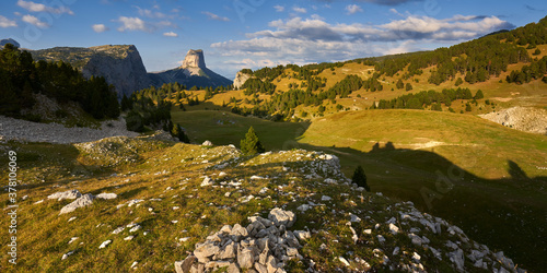 Mont Aiguille and the Vercors High Plateaus in Autumn at sunset (panoramic). Vercors Regional Natural Park, Isere, Rhone-Alpes, Alps, France