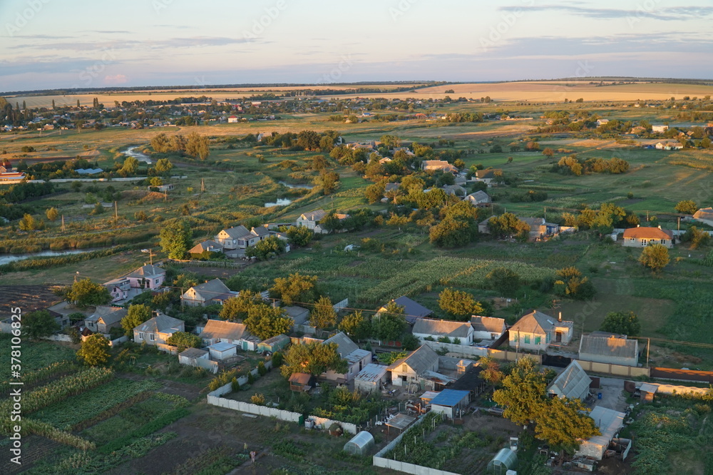 Top view of the village in the rays of the setting sun