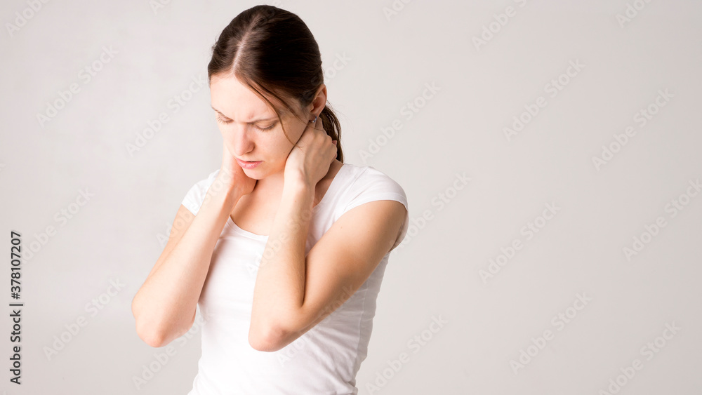 Tired woman feeling pain, massaging tense muscles Tired woman feeling pain, massaging tense muscles