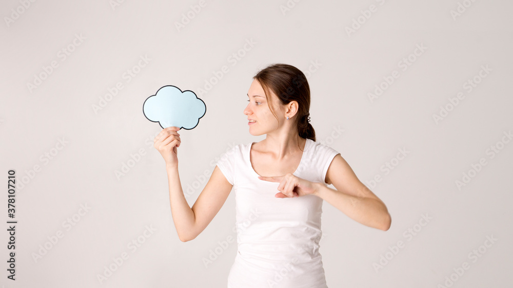 Surprised happy woman in shirt holding blank speech bubble Surprised happy woman in shirt holding blank speech bubble
