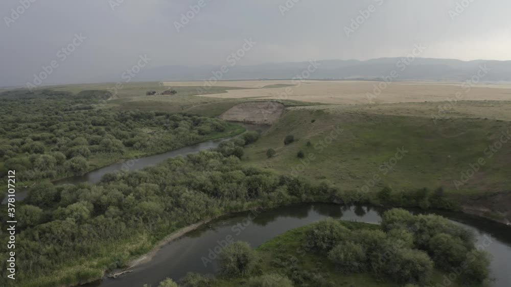 Aerial View of Horseshoe Creek, Snake Shape River in Teton Scenic Byway, Idaho Countryside, USA - fast drone panoramic move Aerial View of Horseshoe Creek, Snake Shape River in Teton Scenic Byway, Idaho Countryside, USA - fast drone panoramic move