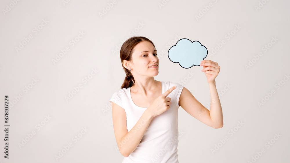 Surprised happy woman in shirt holding blank speech bubble Surprised happy woman in shirt holding blank speech bubble