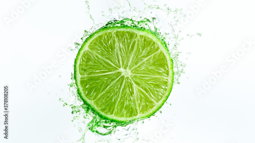 Fresh ripe lime with splash...