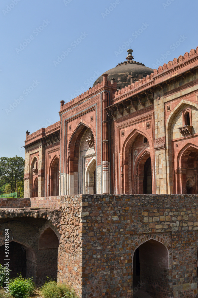 A mesmerizing view of architecture of main tomb at old fort from side lawn.