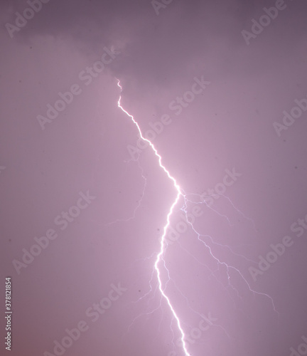 Lightning in the sky at night as an background.