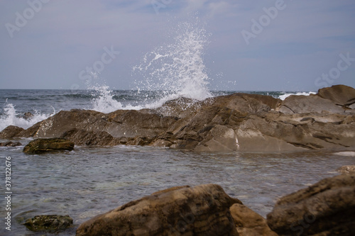 waves crash on stones