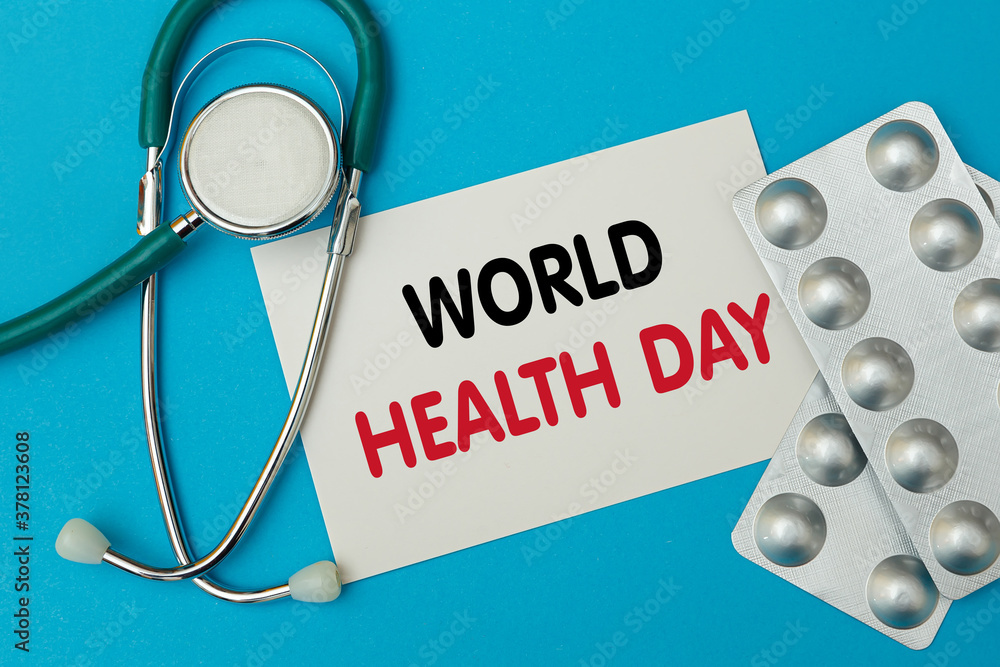 Stethoscope with notebook and clipboard writing WORLD HEALTH DAY Stethoscope with notebook and clipboard writing WORLD HEALTH DAY