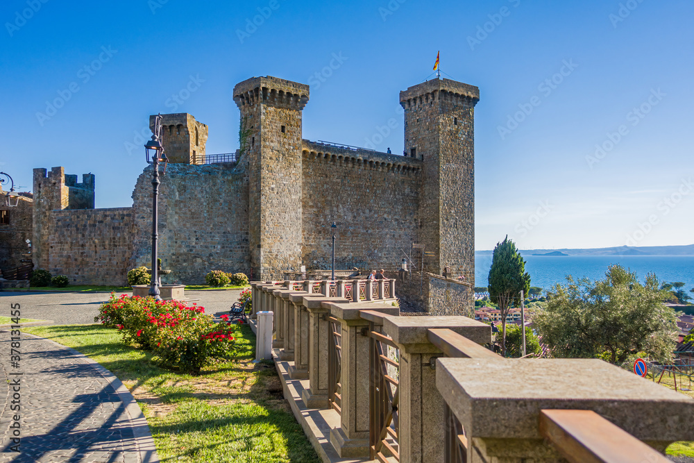 Bolsena, Italy - The old town of Bolsena on the namesake lake. An italian visit in the medieval historic center and at the port. Here in particular The Castle Rocca Monaldeschi of Cervara - obrazy, fototapety, plakaty 