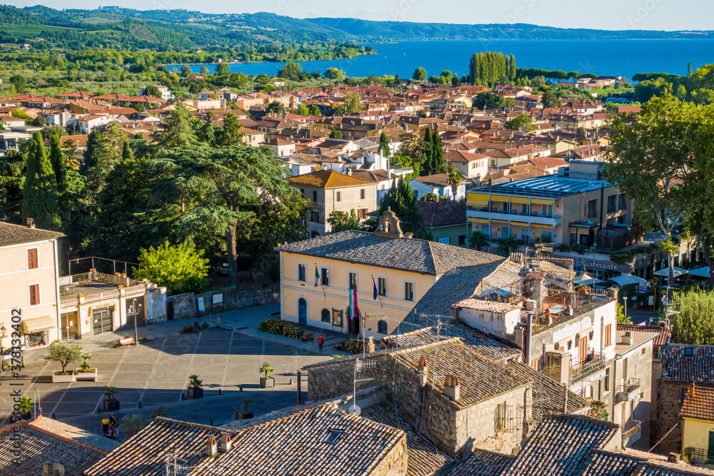 Fototapeta premium Bolsena, Italy - The old town of Bolsena on the namesake lake. An italian visit in the medieval historic center and at the port. Here in particular The Aerial View.