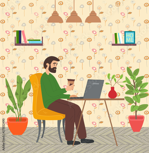 Bearded man with coffee sitting at table in room and correspondence surfing the Internet. Male character communicating through network on the laptop. Freelance, work from home and home office concept