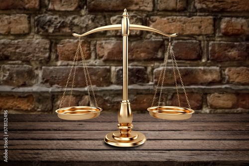 Symbol of justice law scales on wooden desk