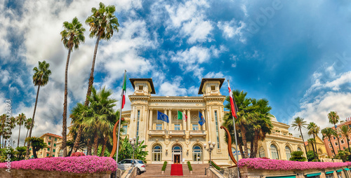 Facade of the scenic Sanremo Casino with palms and flowers photo