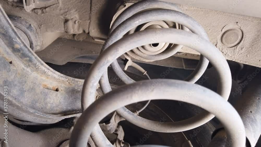 Close up of old car suspension service in maintenance car garage Close up of old car suspension service in maintenance car garage