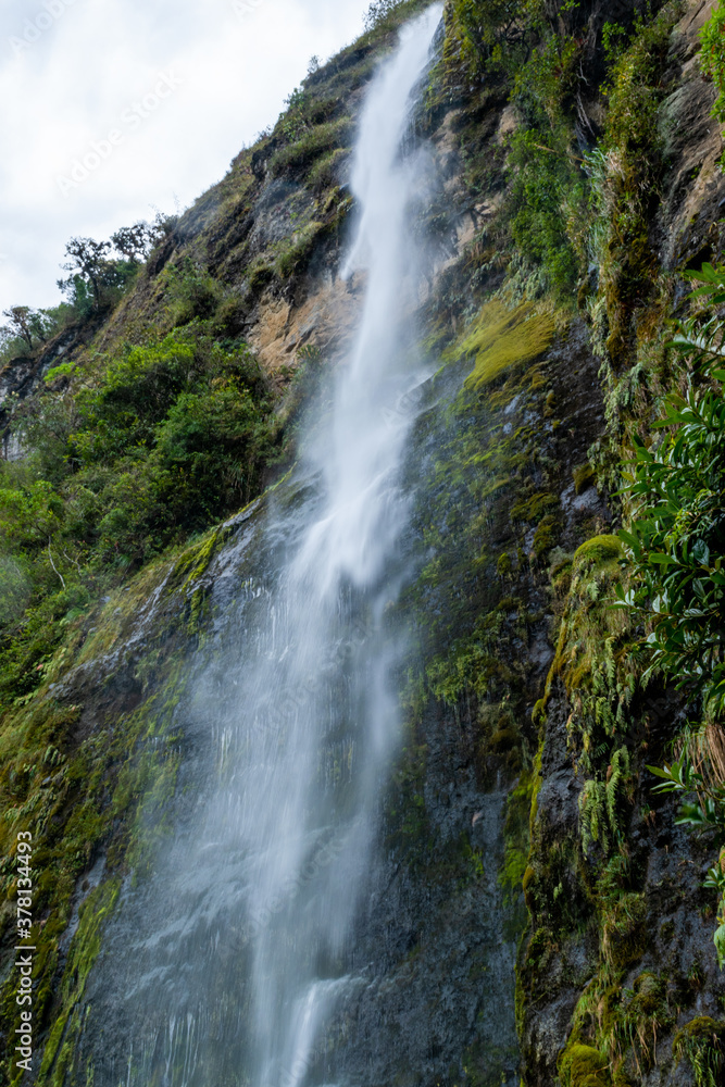 Waterfall from the mountain in free fall in Giron, Ecuador