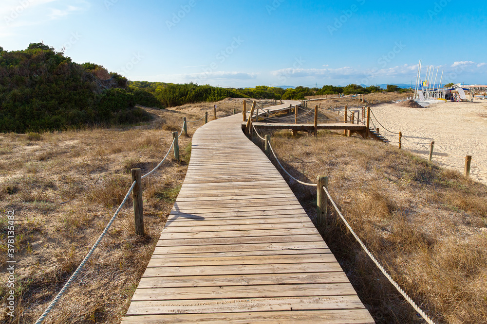 Wooden plank road off the coast of Formentera, Spain, Mediterranean sea.