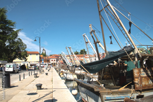 Old fishing boat in the harbor of seaside resort Novigrad (Cittanova) in Istria, Croatia