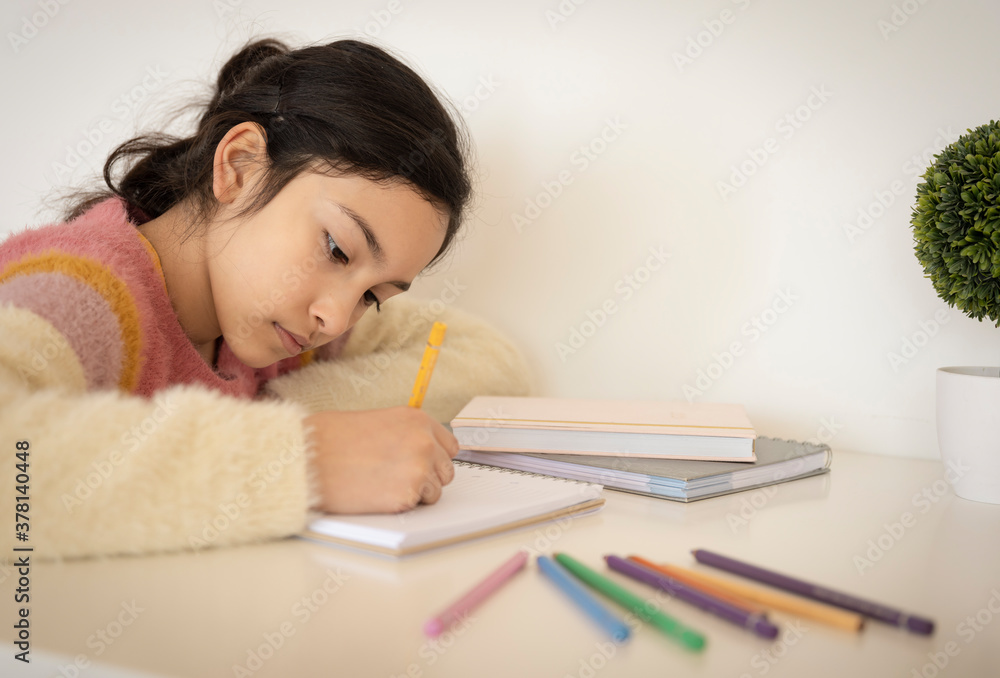 Girl painting with colored pencils Girl painting with colored pencils