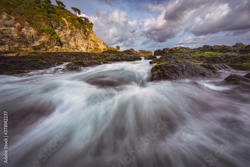 Sea wave flowing and spreads view in long exposure shot