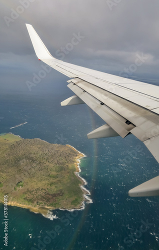 Sloping Island with rainbow from a flight. Tasmania, Australia. June 13, 2019.