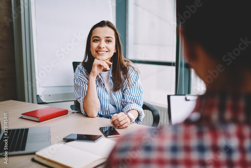 Tablou canvas Selective focus on successful woman listening male colleague during positive con