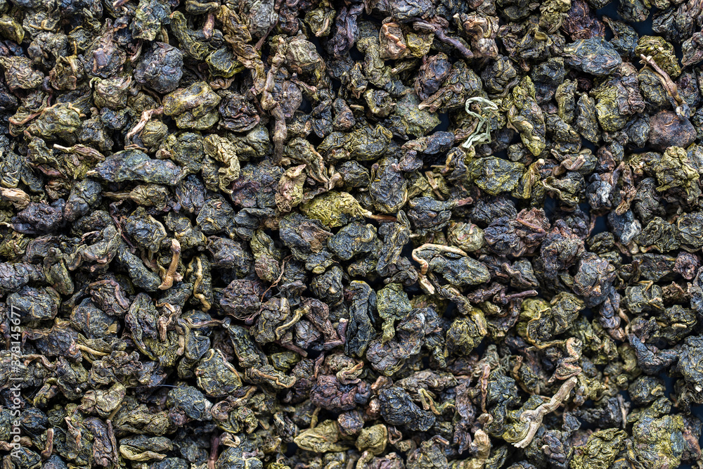Green tea leaves background and texture, macro shot Green tea leaves background and texture, macro shot