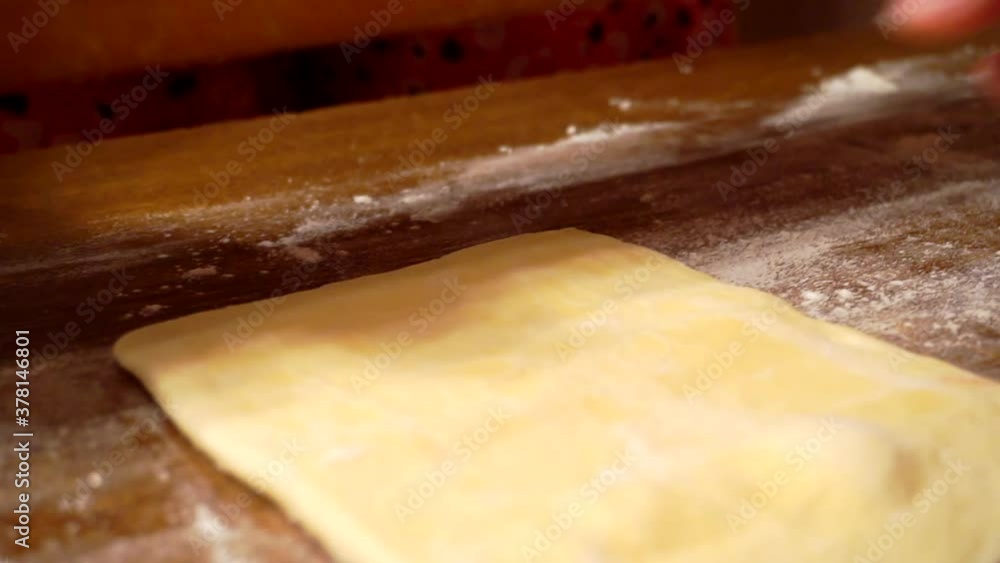homemade food.hands work with dough on a wooden table.close-up. homemade food.hands work with dough on a wooden table.close-up.