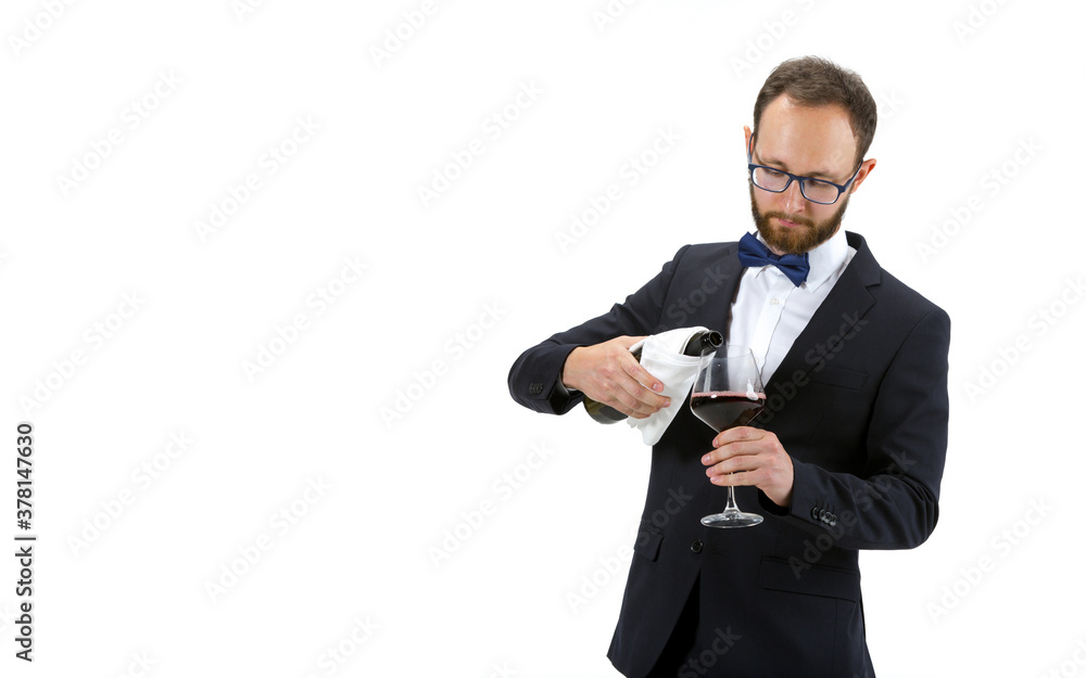 Pouring red wine. Portrait of male sommelier, wine steward or bar worker in white and black suit isolated over white background. Copyspace for ad. Concept of professional occupation, job. Pouring red wine. Portrait of male sommelier, wine steward or bar worker in white and black suit isolated over white background. Copyspace for ad. Concept of professional occupation, job.