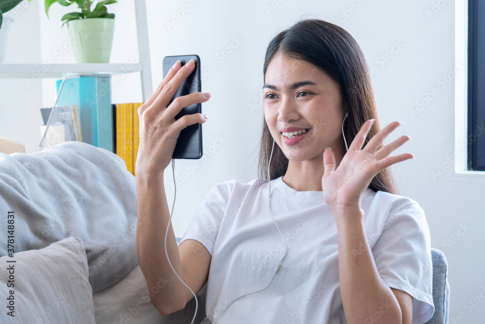 Asian woman talking with friends using video chat conference, Long distance communication, Home quarantine or prevention of coronavirus infection. Asian woman talking with friends using video chat conference, Long distance communication, Home quarantine or prevention of coronavirus infection.