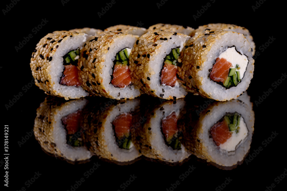 Fresh delicious beautiful sushi rolls on a dark background Fresh delicious beautiful sushi rolls on a dark background